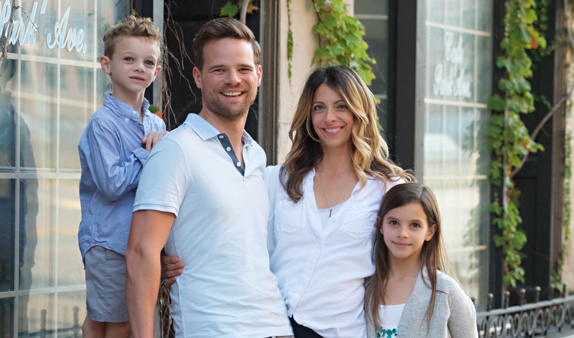 Andy Hill with his family out side of their home