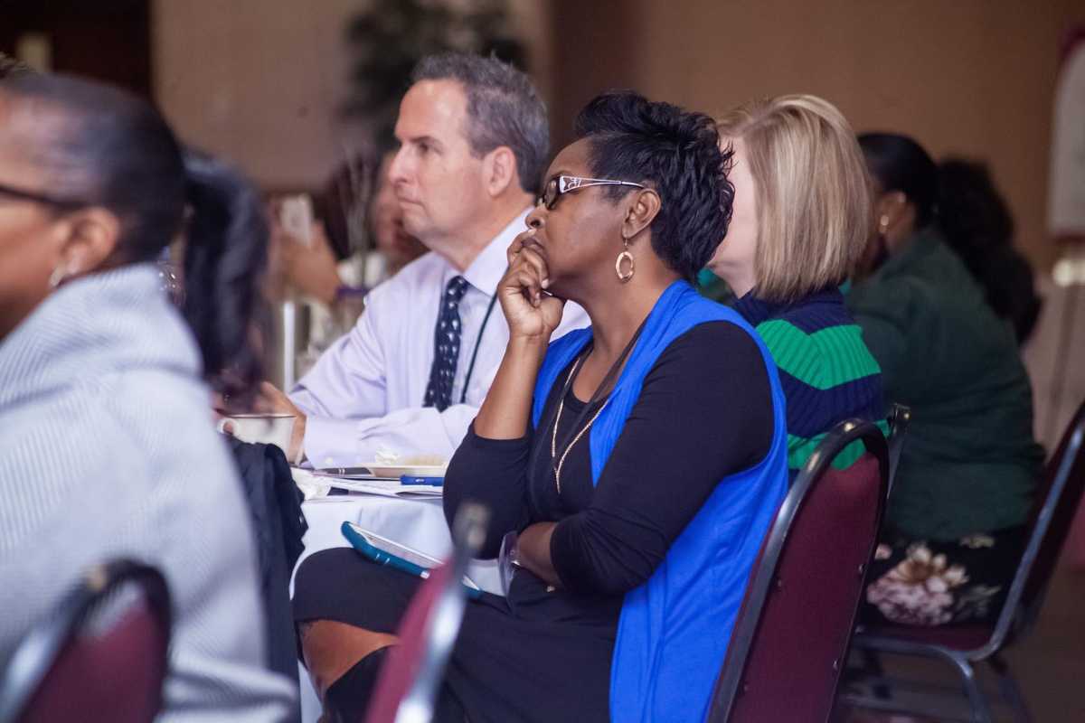 Woman listening closely at seminar